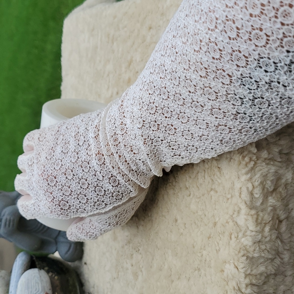 Elbow length lace and mesh vintage gloves.